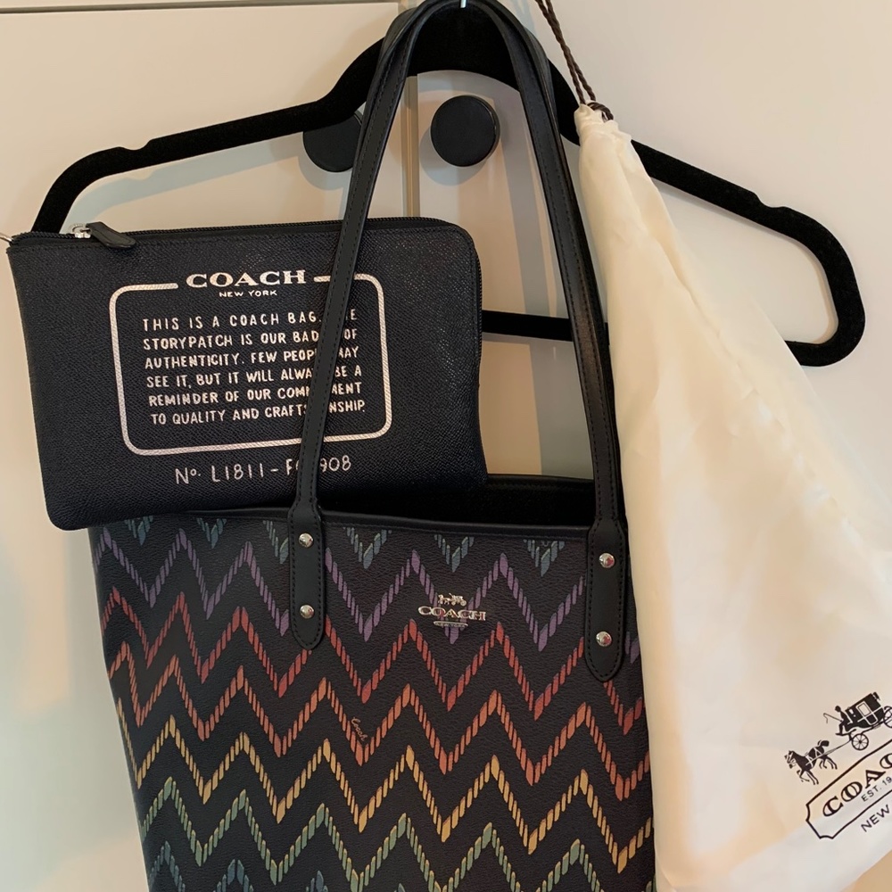 Coach reversible tote with pouch, multi color and navy on the opposite side.